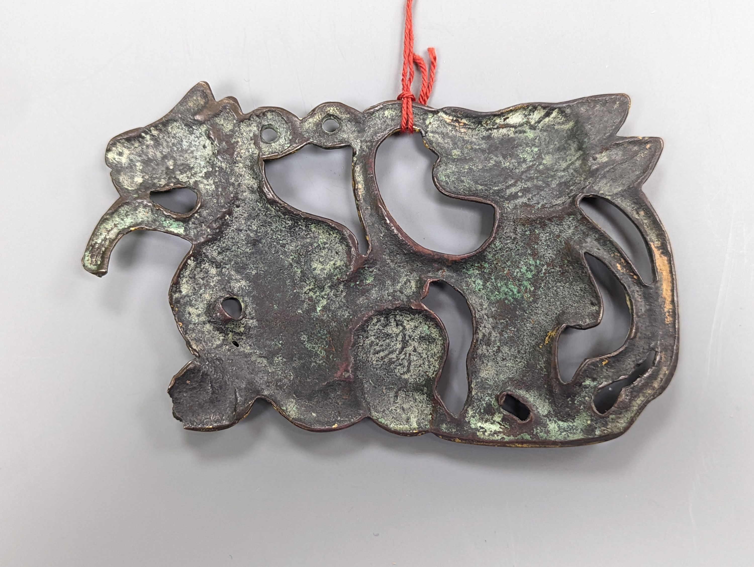 A Chinese gilt bronze plaque, 12cm. wide